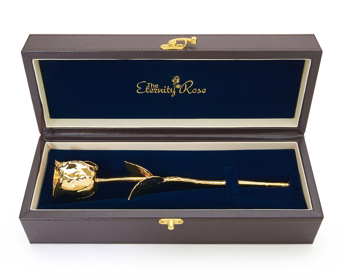 A natural rose preserved in 24 karat gold and presented in a leather display case